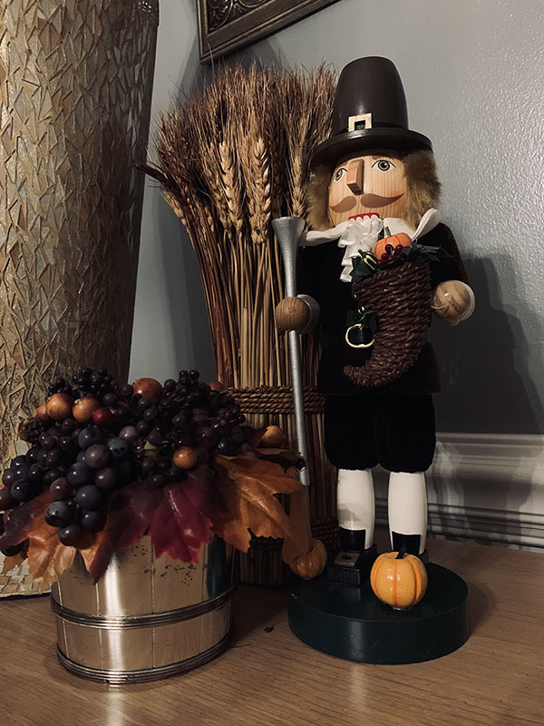 A Thanksgiving nutcracker with some extra fall decor.