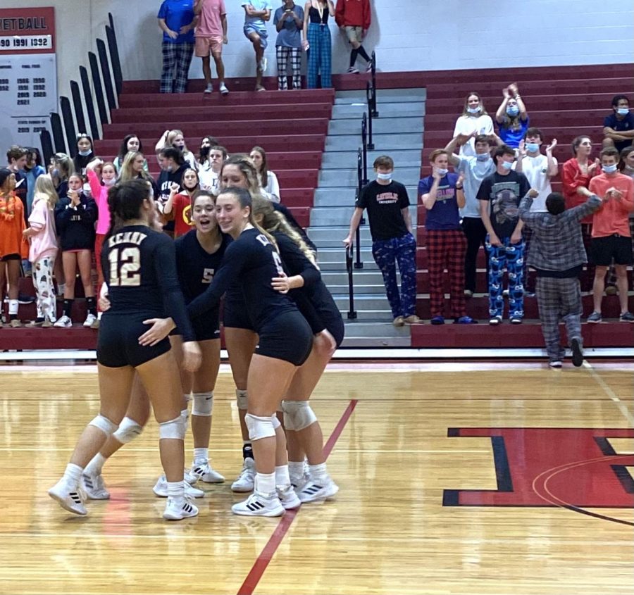 The starting lineup celebrates scoring against Middleburg’s team. 