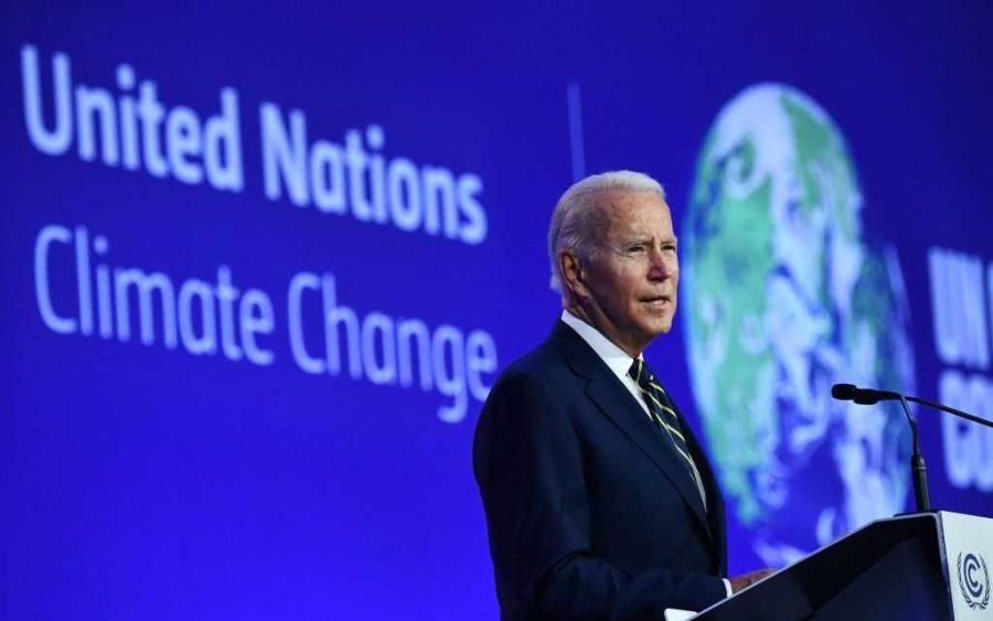 TOPSHOT - US President Joe Biden delivers a speech on stage during a meeting at the COP26 UN Climate Change Conference in Glasgow, Scotland, on November 1, 2021. - COP26, running from October 31 to November 12 in Glasgow will be the biggest climate conference since the 2015 Paris summit and is seen as crucial in setting worldwide emission targets to slow global warming, as well as firming up other key commitments (Photo by Brendan Smialowski / AFP) (Photo by BRENDAN SMIALOWSKI/AFP via Getty Images)