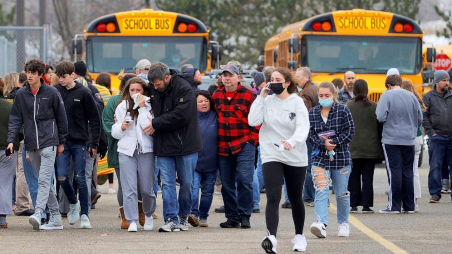 Students, parents and faculty walking away from Oxford High School following the school shooting (Photo Courtesy of ABC News).