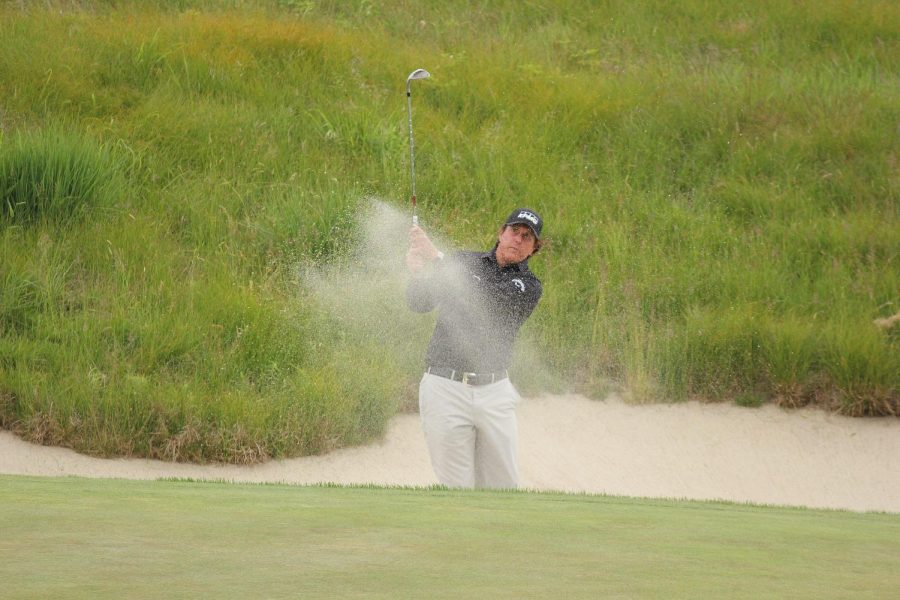 Mickelson hits a shot out of the bunker during the 2018 U.S. Open.