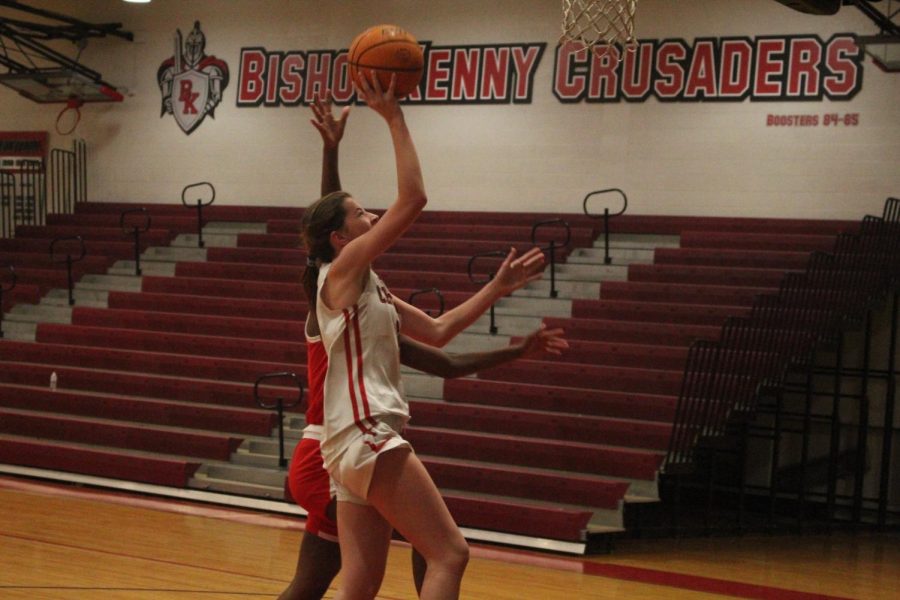 Freshman Rylie Muldoon goes for a layup underneath the basket.