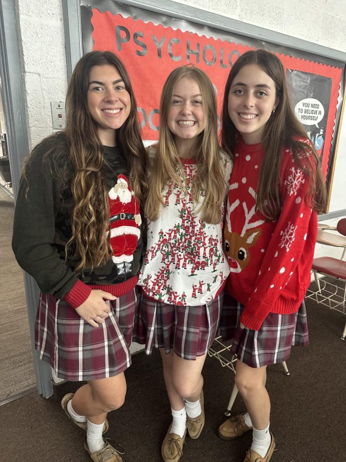 Seniors Emma Milton, Emma Leahy and Ava Larson dressed up in Christmas Day gear.