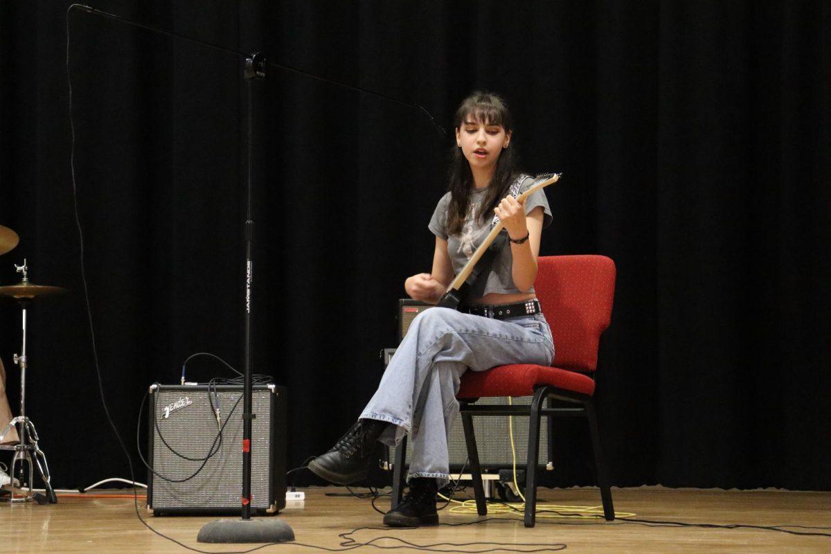 Junior Tabitha Dooley charms the audience with her voice and electric guitar
