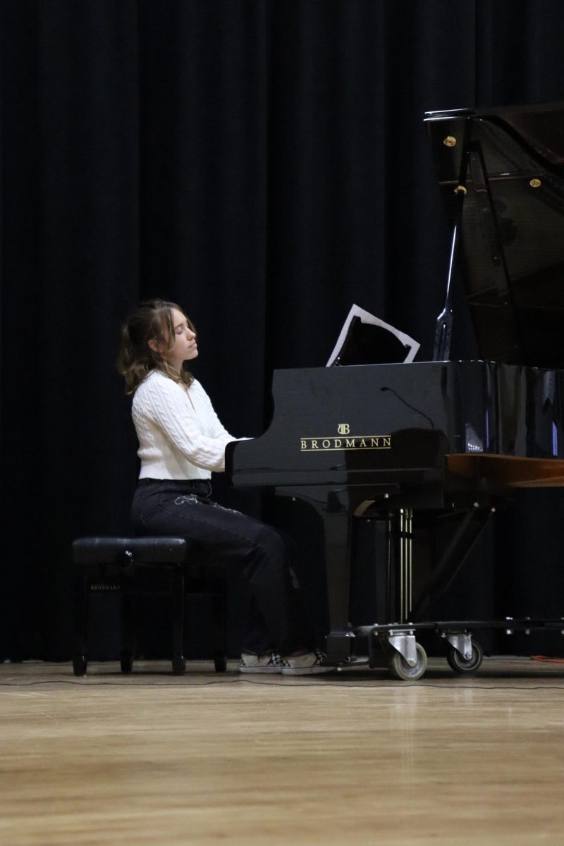 Senior Melanie Staples feels the music as she plays the piano