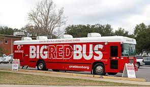 The Big Red Bus making a stop to collect donations.