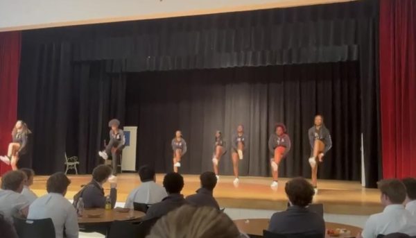 Step Team performs their routine at lunch.