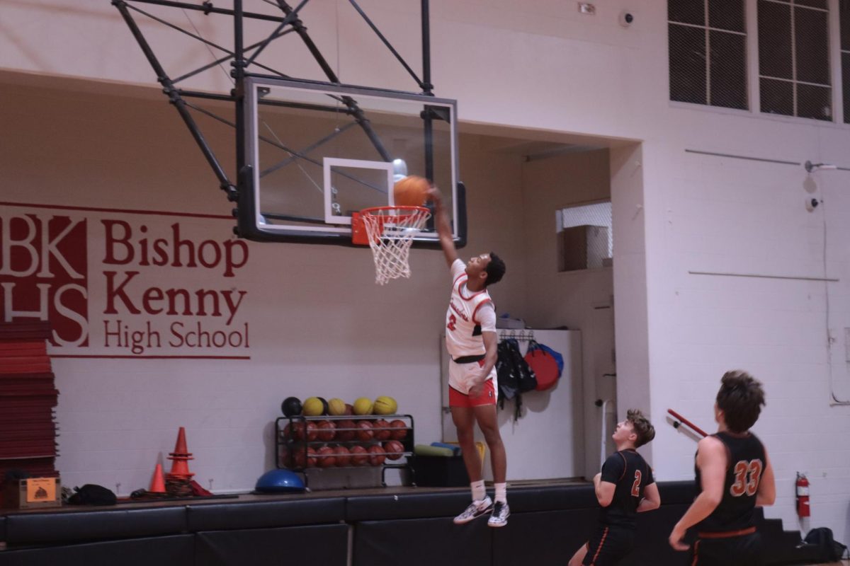 Junior Jaden Ransom goes for the dunk.