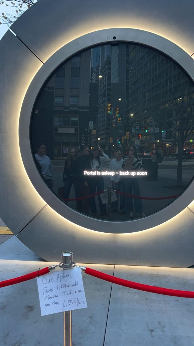 The shield staff looking at the turned off portal at LOVE park in downtown Philadelphia.