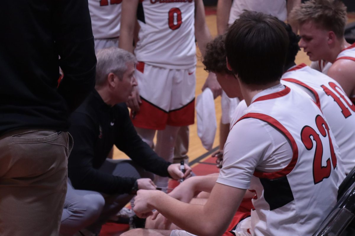 Coach Buckley drawing plays for the team during a timeout. 