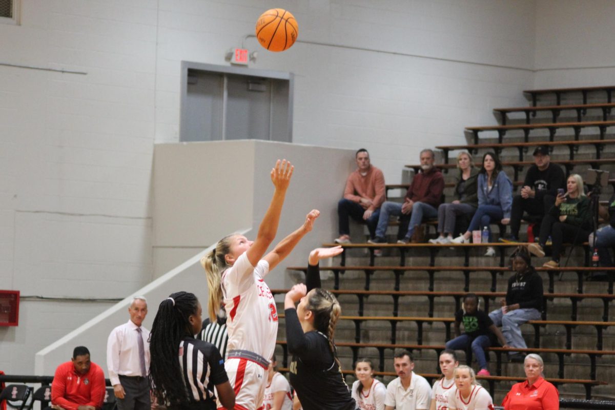 Senior Abby Baker jumps for the jump ball.