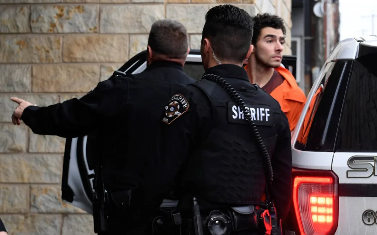 Luigi Mangione escorted by police into the Blair County Courthouse in Hollidaysburg, Pennsylvania. 